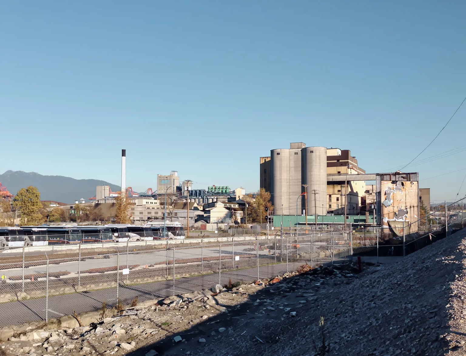 BC Sugar Refinery industrial complex in East Vancouver, with its iconic brick warehouse, silos, and surrounding industrial structures, representing a significant part of Vancouver's history.